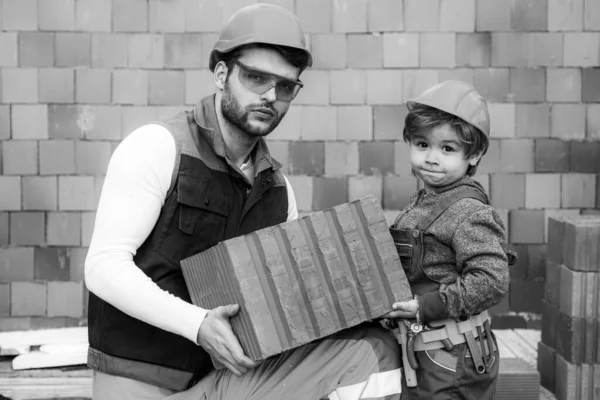 Brothers bricklayers make masonry, builders work with brick layer. — Stock Photo, Image