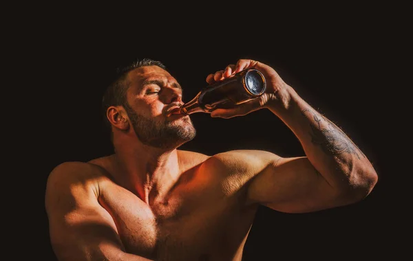 Man with bottle of beer, close up face. Drunk man drinker alcoholic with alcoholism problem, alcohol abuse addiction concept. Drunken man behavior.