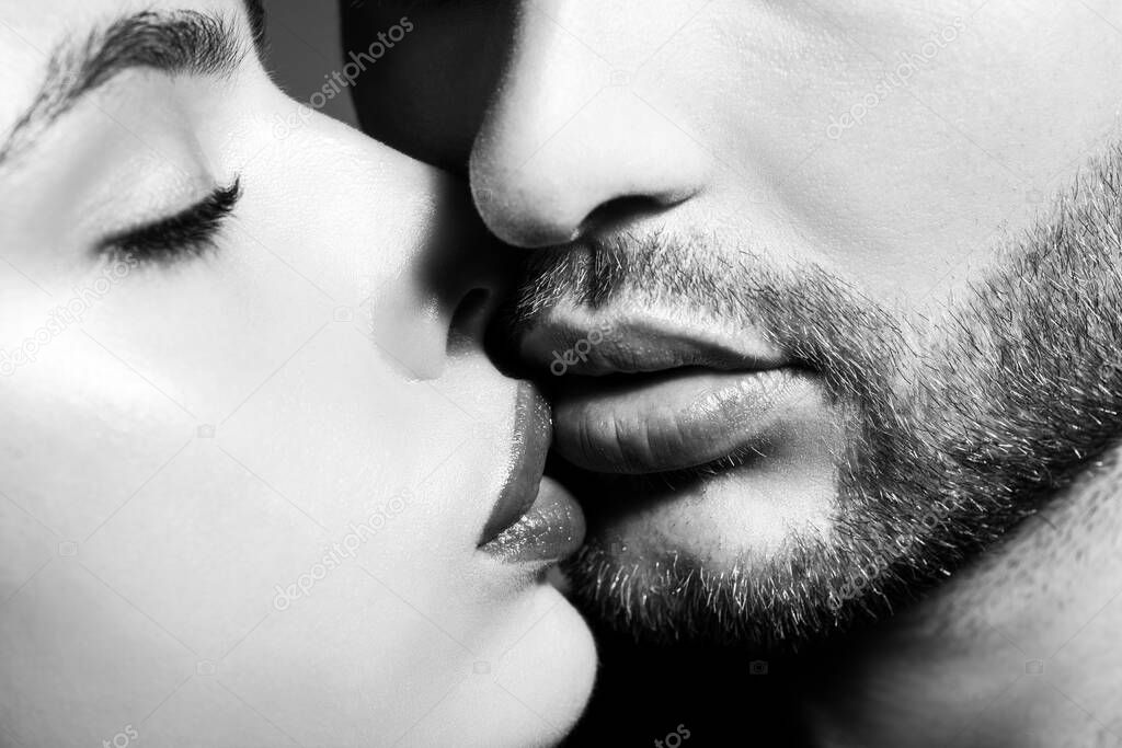 Kissing couple in love. Close up portrait of gentle gorgeous attractive married people kisses.