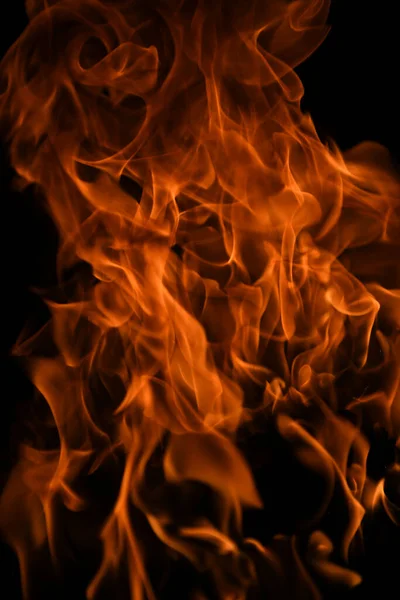 Flammenbrände. Brennende Lichter auf schwarzem Hintergrund. Feuerflammen auf schwarzem Hintergrund. Abstrakter Hintergrund der Brandflamme. — Stockfoto