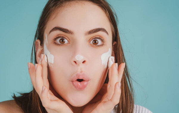 Beauty portrait of beautiful female model. Amazed surprised woman with beauty face, natural skin, facial skin portrait.