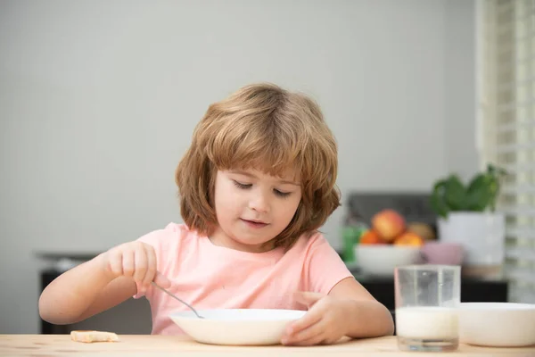 Child eating healthy food. Cute little boy having soup for lunch. — Stock Photo, Image