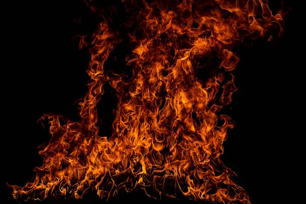 Texture of fire on a black background. Abstract fire flame background, large burning fire. — Stock Photo, Image