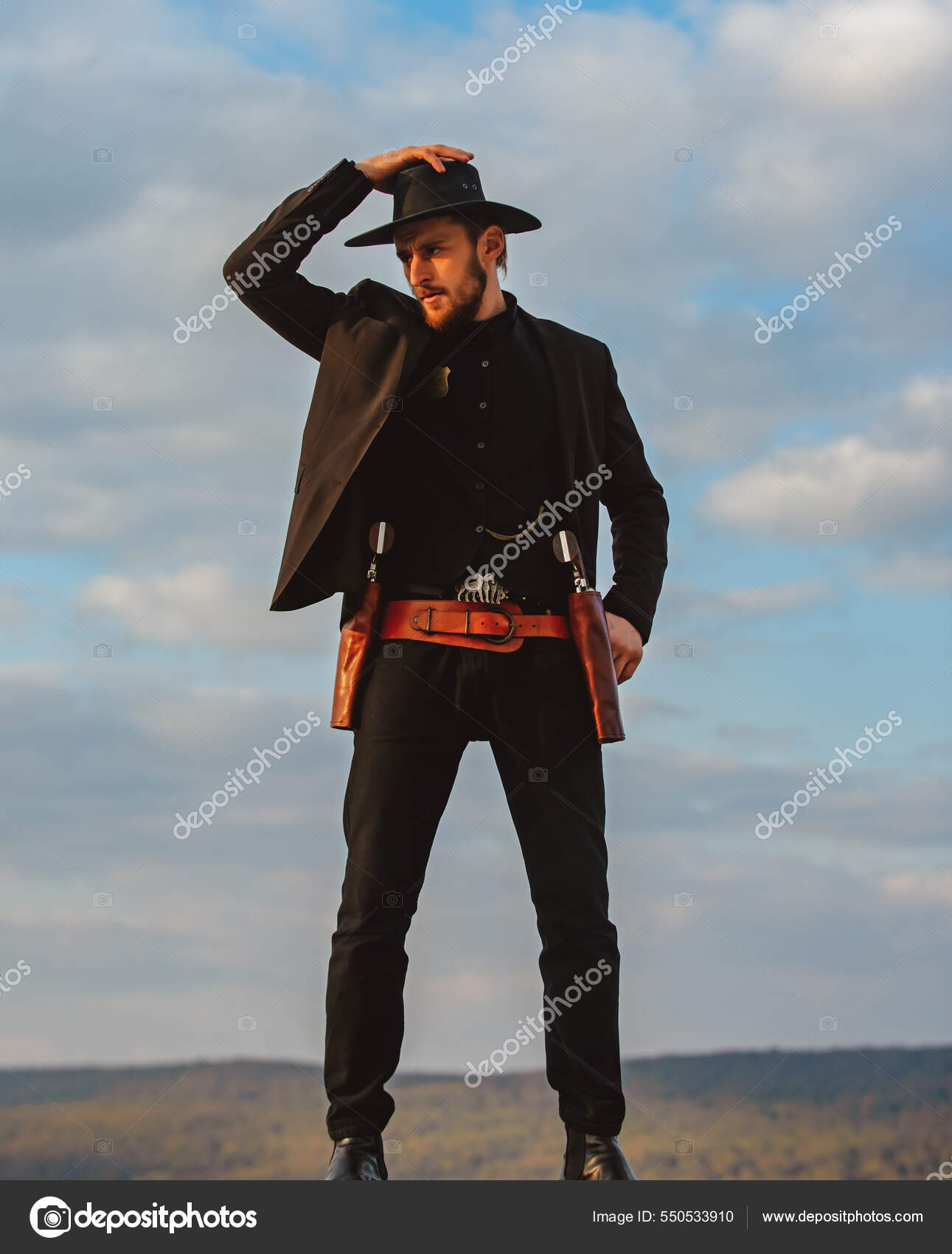 Sheriff or cowboy in black suit and cowboy hat. Man with west vintage ...