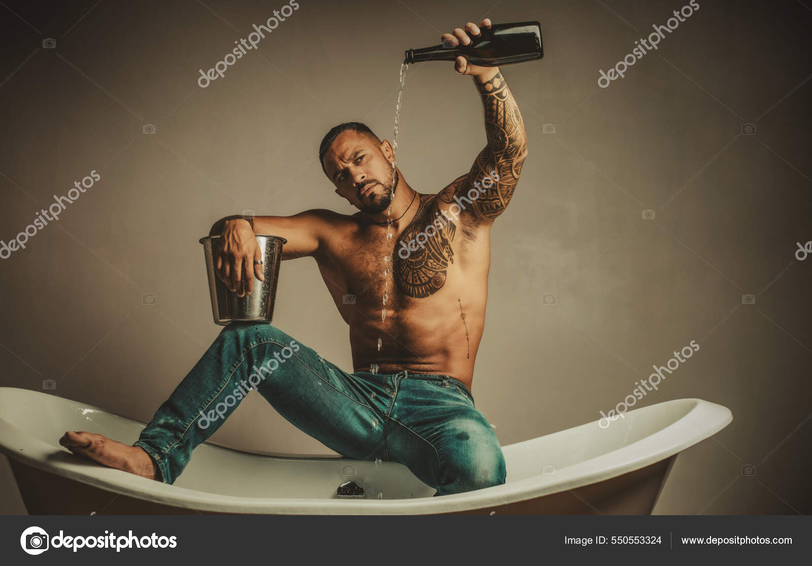 Sexy undress man sit on bathtub in bathroom, men holiday with champagne