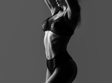 Sexy transparent lingerie. Women with large breasts. Sexy breas, boobs in bra, sensual tits. Beautiful slim female body. Lingerie model. Closeup of sexy female boob in black bra.