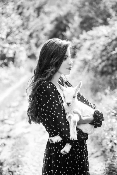 Spring girl with lamb. Goat milk. Sensual woman with goat. Animal, countryside. Friends with animals. — Stock Photo, Image