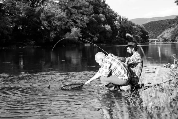 Elegant bearded men fishing. Family day. Man bearded fisher. Keep calm and fish on. Catching and fishing. Retired bearded fisher. Hunting. Summer leisure. Mature man with friend fishing. — Stock Photo, Image