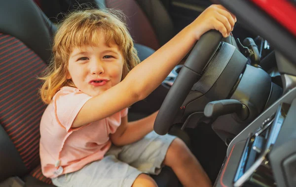 Child kid driver. Child boy driving car as driver. Baby kid sitting in seat. — Stock Photo, Image