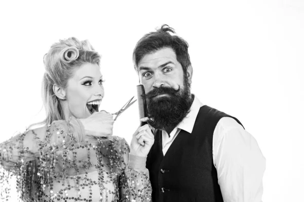 Crazy hairdresser blonde girl grooming handsome bearded man. Hipster man with beard and barber woman. Pretty glamour blonde girl style mans beard. Man style and haircare. — Stock Photo, Image