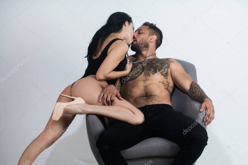 Lovely sexy couple in love. Sensual lovers undressed. Girlfriend and boyfriend sensual hugging. Romantic tender woman and naked sexy man. Beautiful couple.