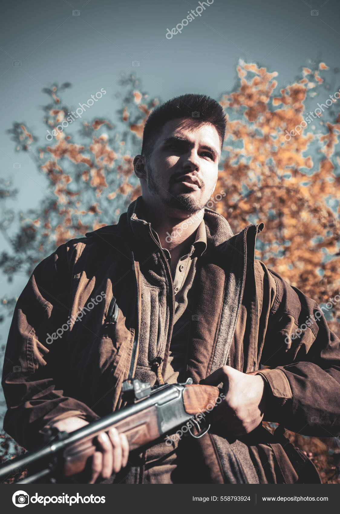 Poacher with Rifle Spotting Some Deers. Illegal Hunting Poacher in the Forest. Hunter with