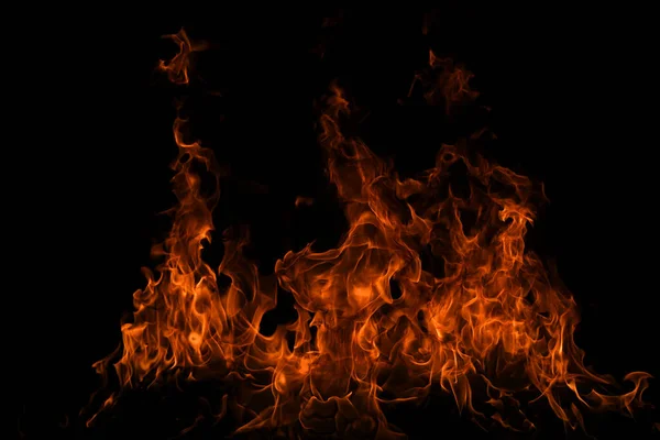 Płomień ognia i ogień świecący na czarnym tle. — Zdjęcie stockowe