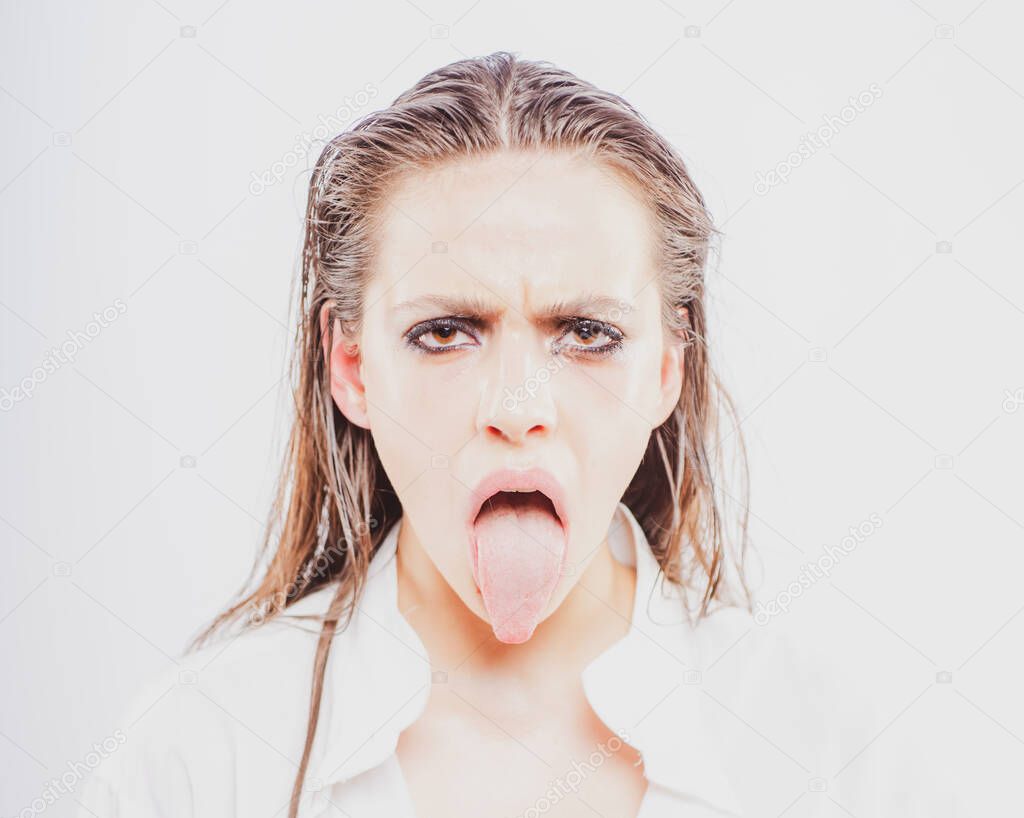 Protesting. Displease Disgust concept. Girl showing tongue in protest.