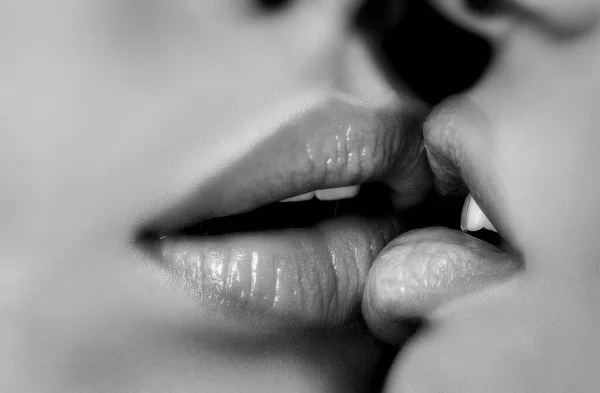Lesbian love close up. Woman kiss. Sensual lips together. Wet girl mouth. Lip balm, cosmetics. Gentle kiss on a date. Relationship between women. Homosexual couple. — Stock Photo, Image