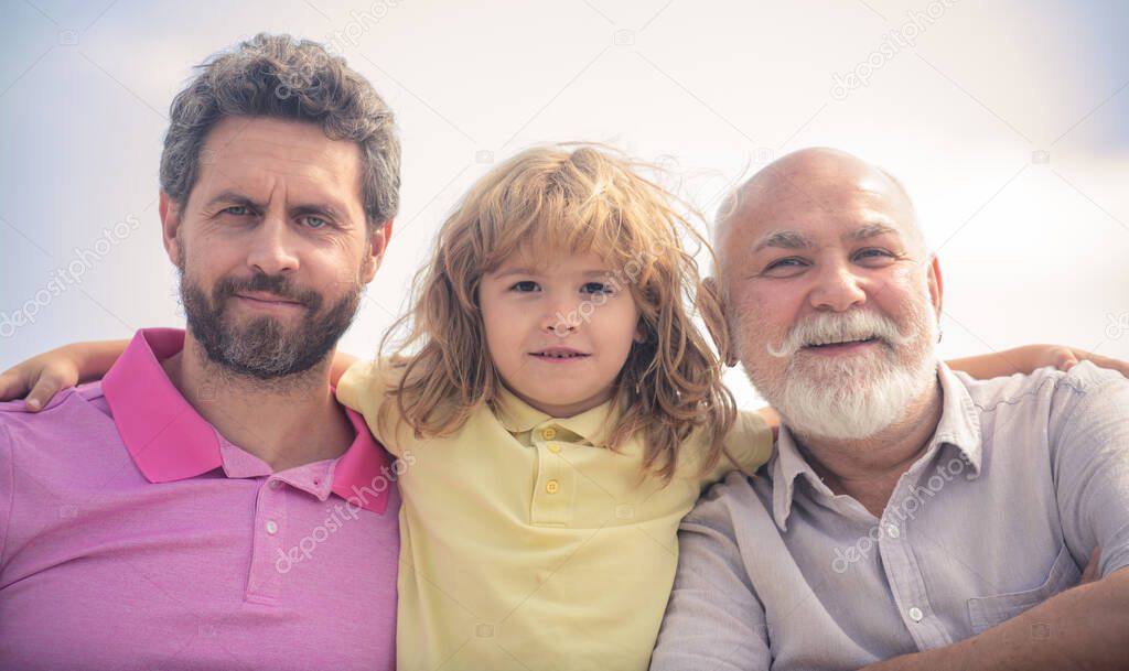 Men generation portrait of grandfather father and son child. Fathers day. Three generations of men together, portrait of smiling boy, dad and granddad.