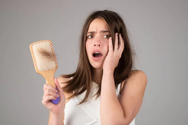 Woman with hair loss problem worried about hair loss.