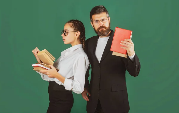 Portrait of teacher and young student teen girl, isolated. Student girl and teacher in school uniform. Education, high school and people concept. — Stock Photo, Image