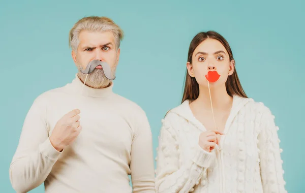 Couple with with fake mustache and lips. Having fun. Photo booth concept. Couple having fun with with fake mustache and lips. — Stock Photo, Image