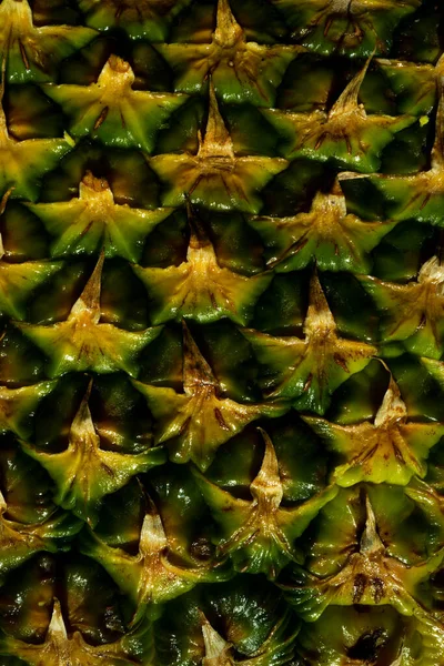 Struktura ananasové slupky. Ananasová kůra. Ananasová textura. Vzorované ovoce pozadí. — Stock fotografie