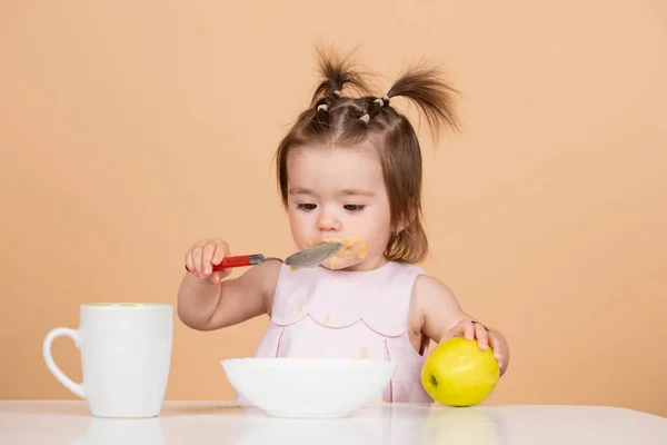 Baby child eating food. Little baby eating fruit puree. — Stock Photo, Image