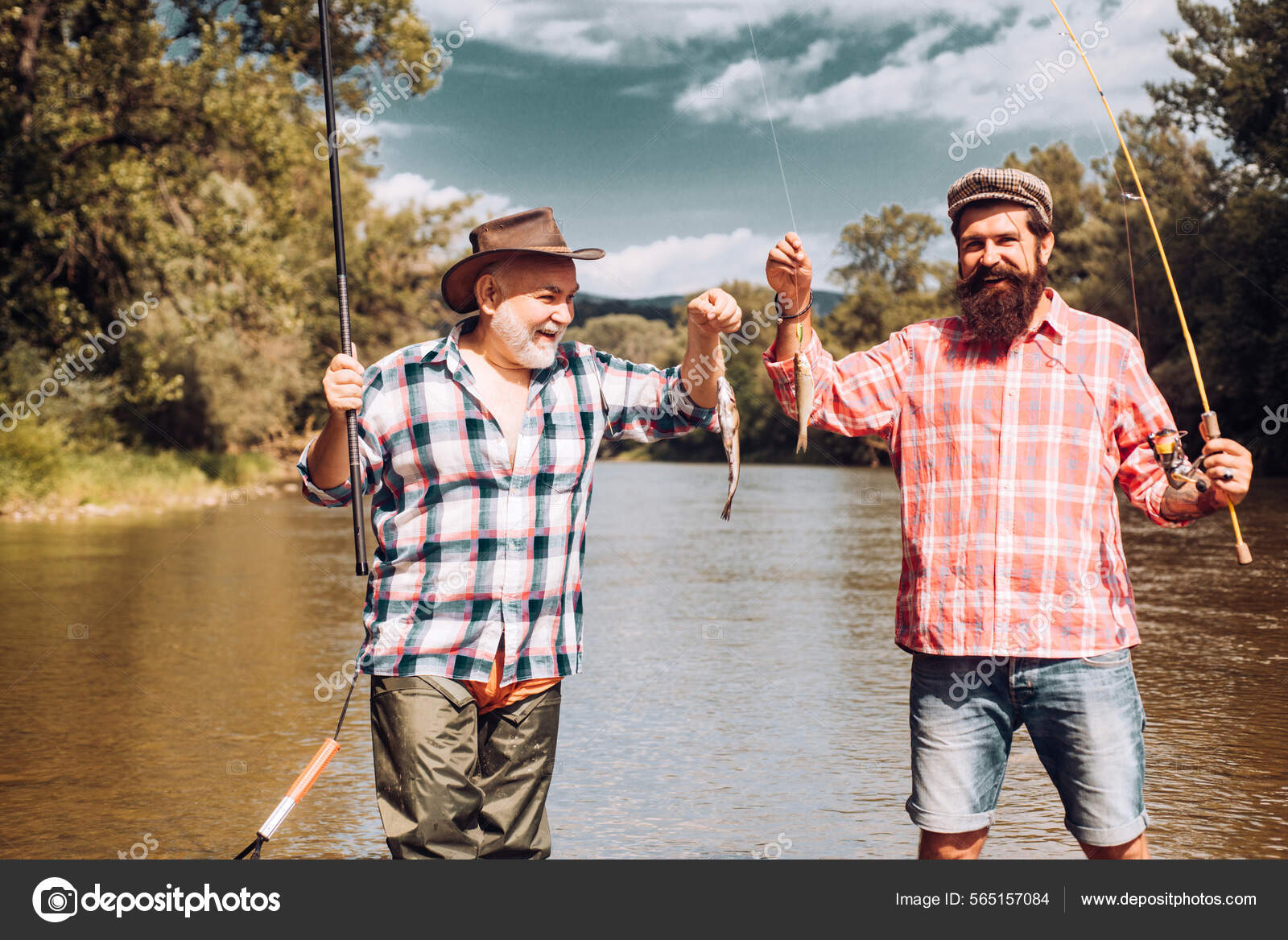 Two men friends fisherman fishing on river. Old father and son with rod  fishing at riverside. Recreational activity. Catching trout fish. Stock  Photo by ©Tverdohlib.com 565157084