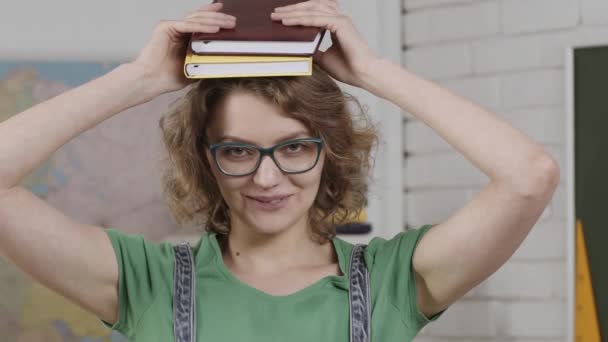 Student. Cheerful smiling female teacher. Smiling girl student or woman teacher portrait at school. Learning concept. — Video Stock