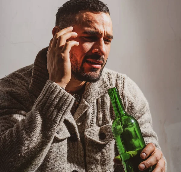 Alcoholic man with bottles wine cry. Depressed crying man. Drunk men drinking alcohol feeling lonely and desperate in emotional stress. — Foto Stock