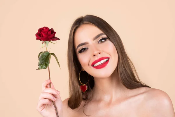 Beauty woman with red rose. Fashion girl face with rose in hand. Red lips. Vogue spring summer style. Birthday day. — Stock Photo, Image