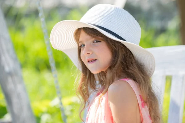 Happy child face. Child teen girl has summer joy. Happy day. Cute playful cheerful kid with funny face. Cute little girl swinging on the meadow in summer day. Portrait of cute teen girl in summer. — Stock Photo, Image