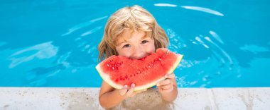 Child with watermelon in swimming pool. Kids eat summer fruit outdoors. Banner for header, copy space. Poster for web design.