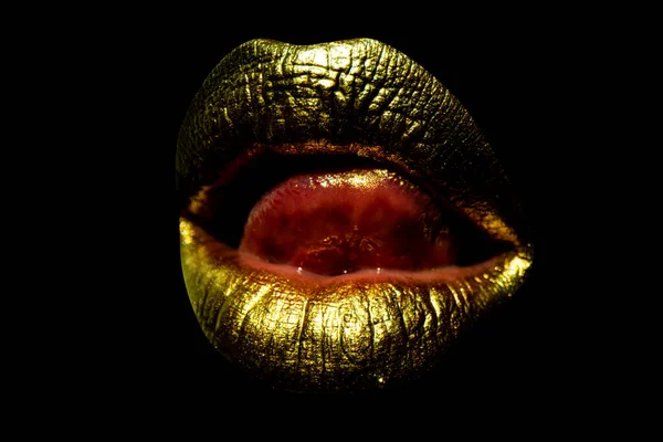 Beautiful lipped woman gold mouth. Sensual golden lips, sexy lip. Woman tongue licking sexy lips.