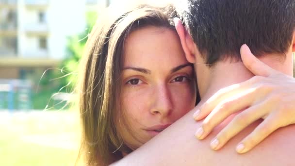 Young couple in love hug each other. Kissing couple portrait. Sensual couple in love outdoor. Outdoor portrait of close up sexy woman face. Romantic lovers. Loving couple embracing. — Stockvideo