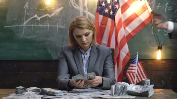 Banking and finance. Portrait of an young business woman counting money dollar banknotes. — Video