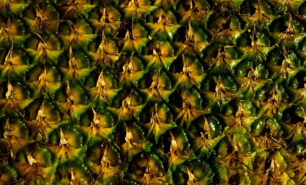 Struktura ananasové slupky. Vzorované ovoce pozadí. — Stock fotografie