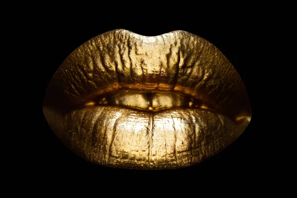 Womans golden lips close up isolated background. Gold sexy mouth. Golden gloss lipstick. — ストック写真