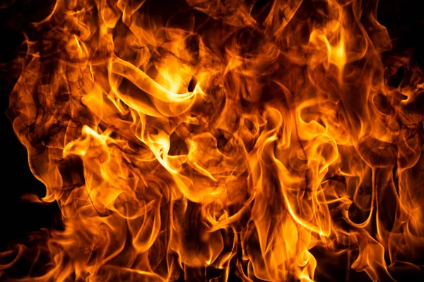 Feuerflammen isoliert auf schwarzem Hintergrund. Fire burn flame isolated, flaming burning art design concept mit Platz für Text. — Stockfoto