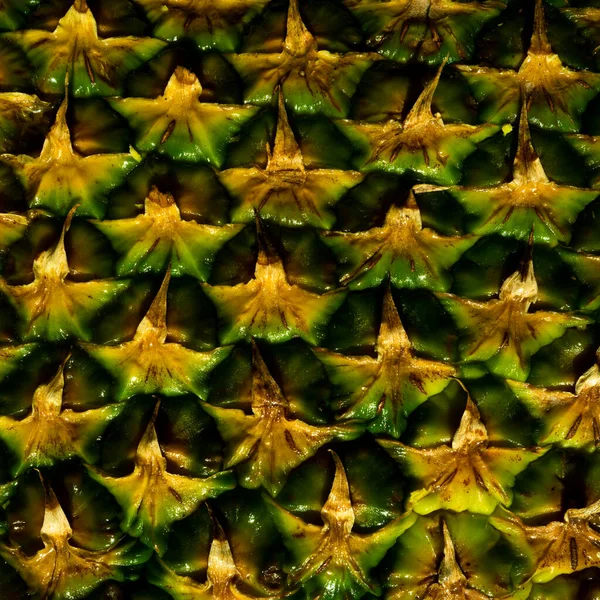 Detailní záběr na texturu ananasové kůry. Ananasová kůra. Ananasový vzor pozadí. Textura ananasové slupky. — Stock fotografie