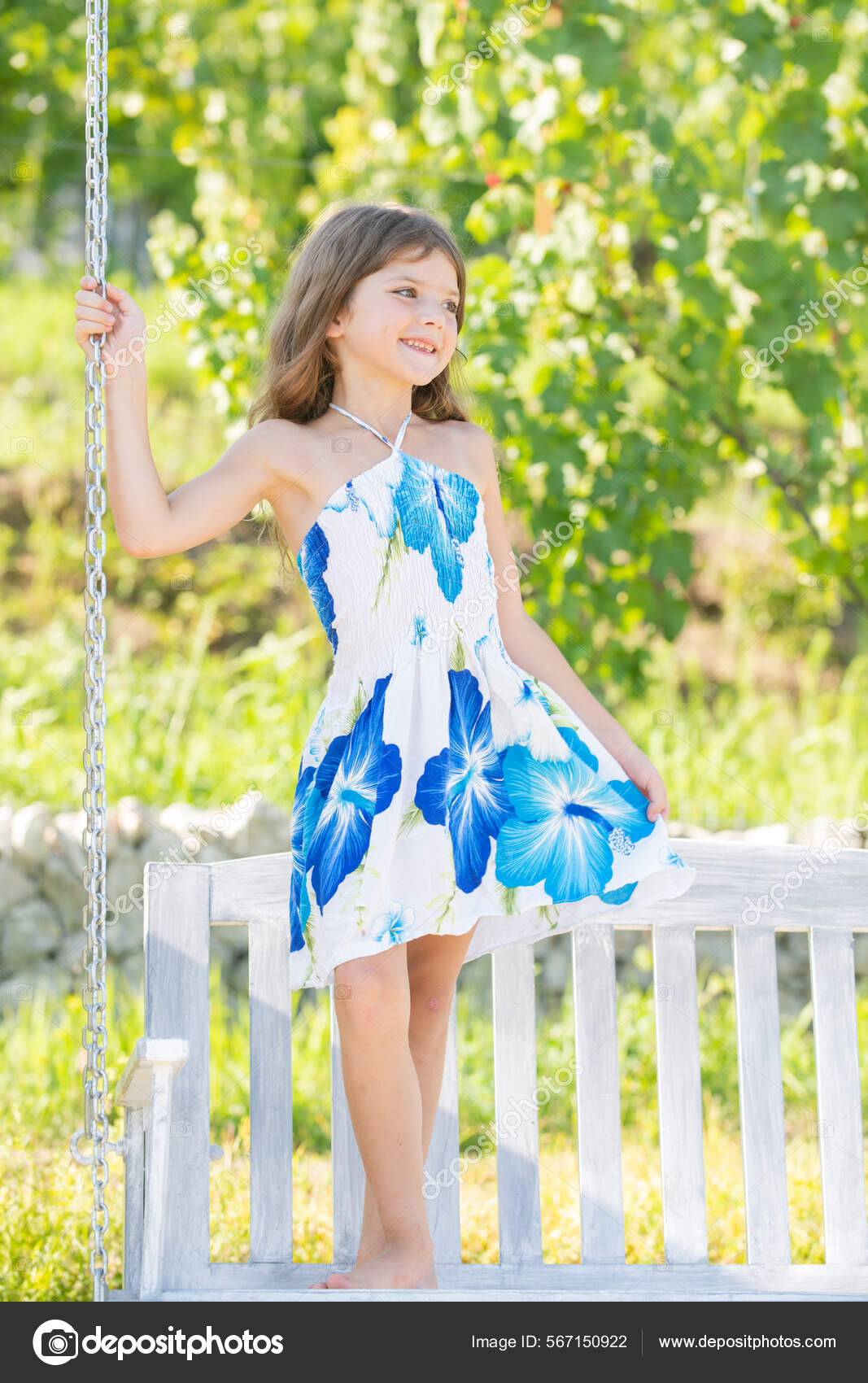 Foto de Beautiful little girl child in fashionable summer clothes