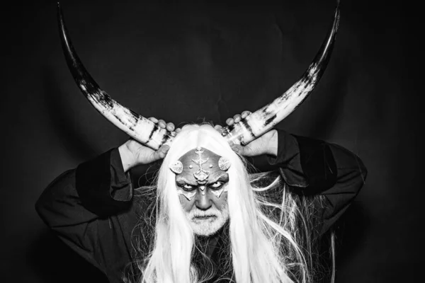 Magic and fairy tale concept. Man evil with horns. Monster with sharp thorns and warts on face. Mysterious warrior enchanted to have thorns on his face. Demon with bloody horns on head. — Stock Fotó