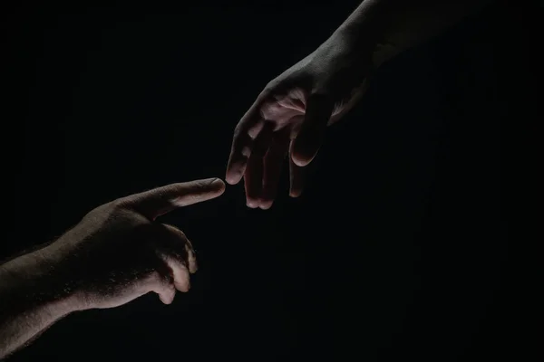 Two hands at the moment of farewell. The holding hands of relations. Help friend through a tough time. Rescue gesture, support, friendship and salvation concept. Hand creation of adam. — 스톡 사진