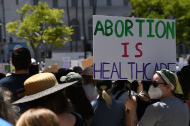 Bans off abortion service, reproductive justice. Womens march rights, abortion body choice. Protect roe. Los Angeles, USA - May, 14, 2022.