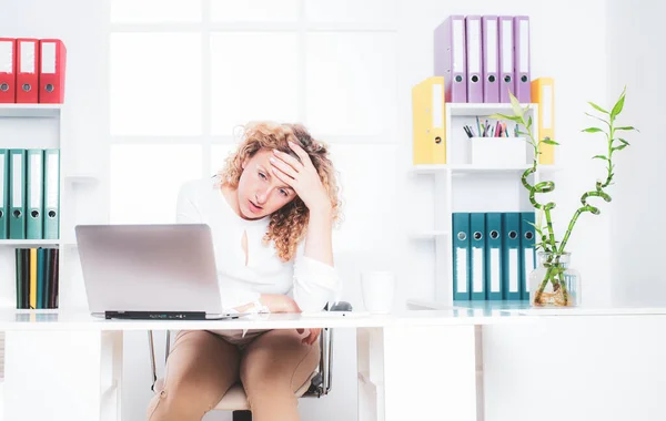Sad office woman. Portrait of businesswoman suffering from headache in office. Disappointed young businesswoman. Trouble of business. Stressed business woman. — Stockfoto