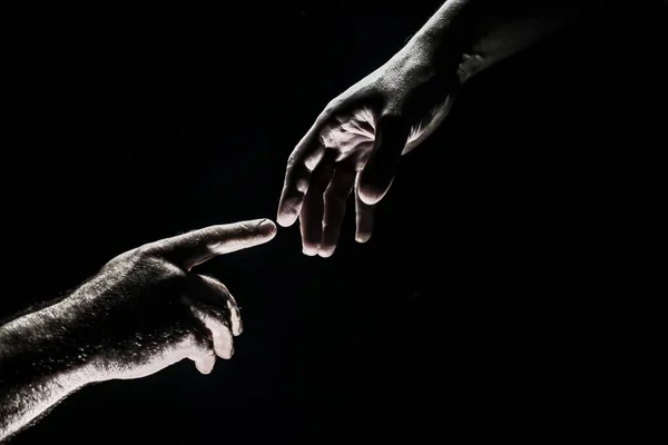 Two hands at the moment of farewell. The holding hands of relations. Help friend through a tough time. Rescue gesture, support, friendship and salvation concept. Hand creation of adam. — Stock fotografie