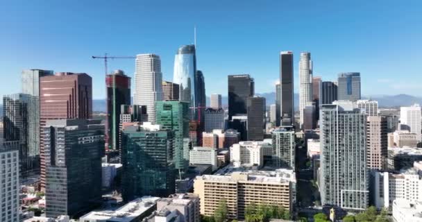 Skyscrapers of Los Angeles downtown, fly LA by drone, top aerial view. Business district, megalopolis, panoramic city. Los Angeles, CA, USA, May 10, 2022. — Vídeo de Stock