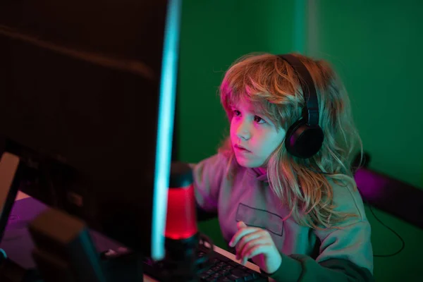 Young girl playing video games on computer after online school and  homework. Gamer using shooting action play for entertainment and fun with  keyboard and monitor. Child enjoying game Stock Photo - Alamy