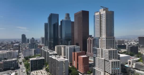Los Angeles. Fly on LA city center by drone, top aerial view. Modern building, skyscraper on cityscape. Los Angeles, CA, USA, May 10, 2022. — Stock Video