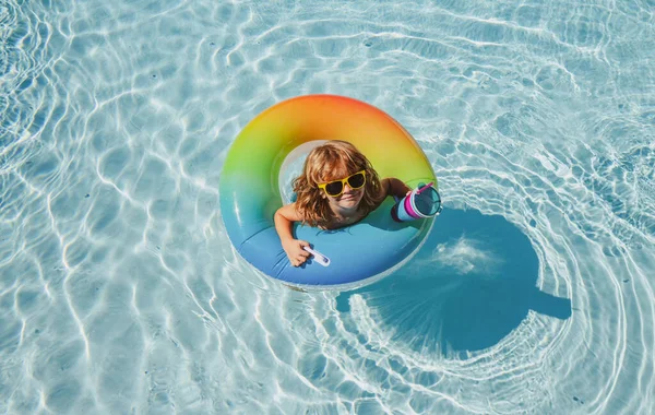 Child in summer pool. Kid in swimming pool. Summer Activities. Kids summer weekend