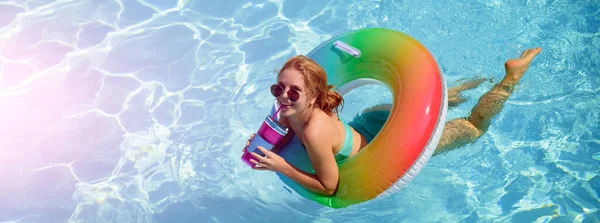 Summertime vacation, summer holiday. Woman on swim ring. Summer mood concept. Pool resort. Banner for design header, copy space