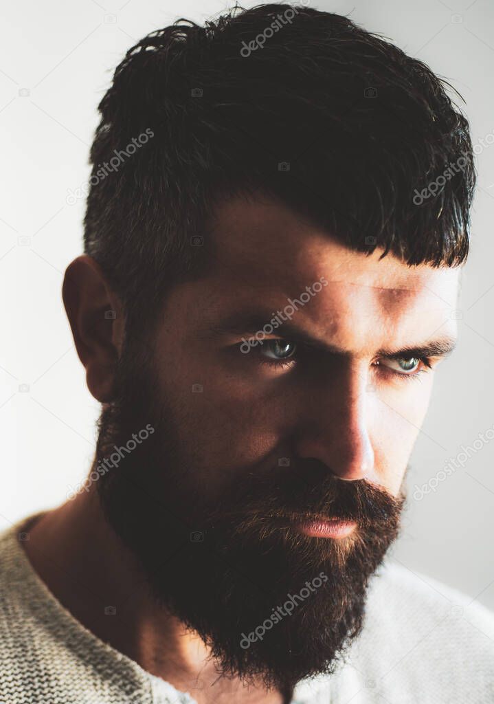 Portrait of confident serious man has beard and mustache. Handsome male model, closeup face. Bearded hipster with moustache in barbershop